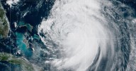 Evacuations in North Carolina as Hurricane Erin grows in size, two waves on its heels
