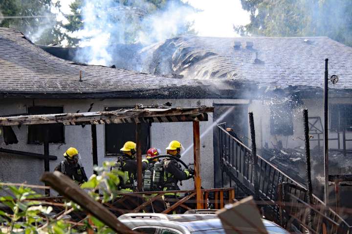 PHOTOS: House burns on Surrey-Delta border, neighbours report explosion
