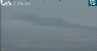 Large fire south of Stockton sends column of smoke into sky