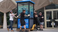 Banksy's piranhas police box put in protective storage ahead of museum display