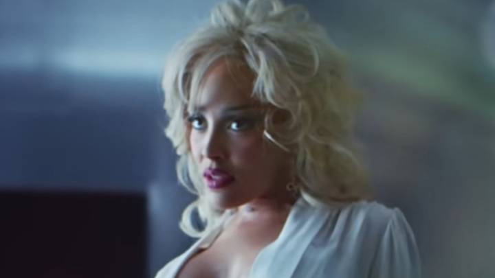 Doja Cat reveals side boob and narrowly avoids NSFW wardrobe malfunction in unbuttoned shirt for racy music video