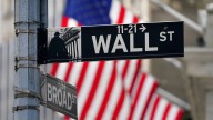 Wall Street steadies, global markets sink after Trump escalates feud with the Federal Reserve