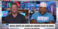 Brawl erupts on landing flight, woman allegedly choked