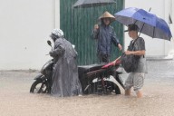 Heavy rain falls in parts of Southeast Asia after tropical storm blows into Vietnam