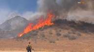 Fire rages amid triple