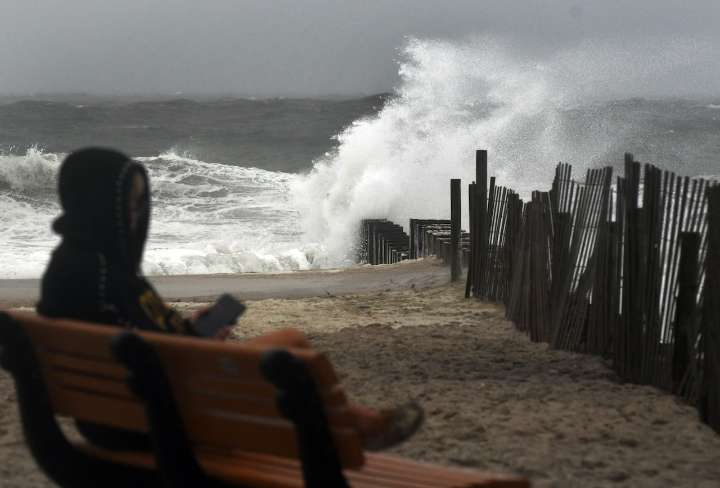 Massive waves at Jersey Shore rose as high as a 1-story house as Hurricane Erin churned the ocean