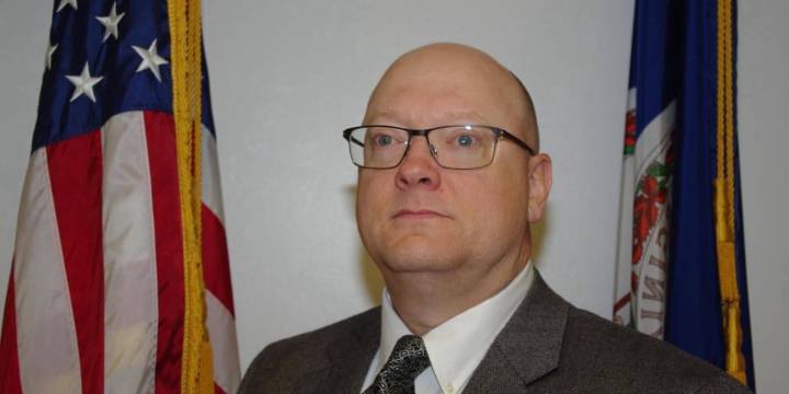 Memorial bench and plaque made in honor of police lieutenant who died of brain cancer