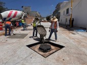 Municipio pavimenta calles en Los Pericos