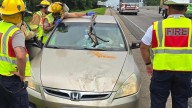 Driver unharmed after debris crashes through windshield on I