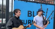 Bagpipe busker belts out Don't look Back in Anger to Oasis fans outside Murrayfield