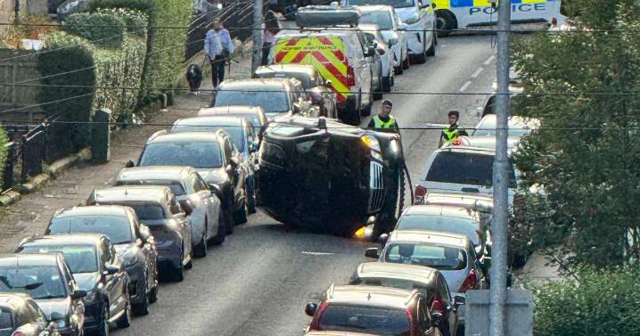 Car flips onto side on Glasgow street during four-vehicle crash as man charged
