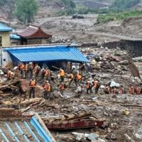 Death toll from northwest China floods rises to 13