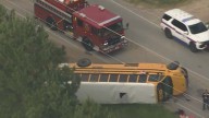 Cleveland ISD school bus overturned, flipped on its side after crashing on FM 1010