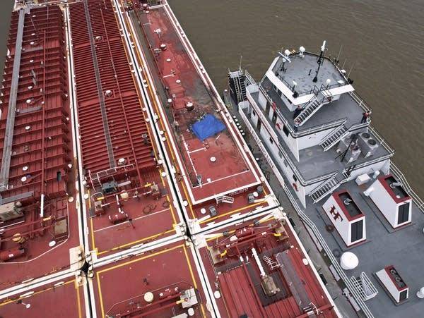 Helicopter crashes into barge in Mississippi River