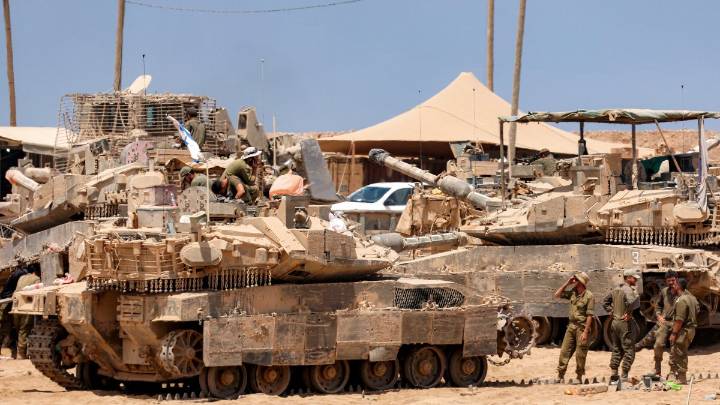 Satellite images show Israel building up forces for possible ground invasion of Gaza, sources say