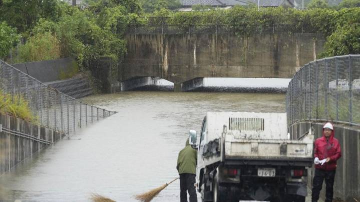 Torrential rains in southern Japan cause flooding, mudslides and travel disruptions