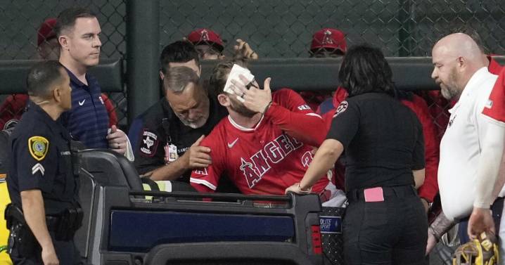 Angels' Taylor Ward carted off field after crashing into scoreboard