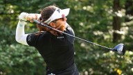 Miranda Wang waits a long time for a short birdie and leads rain