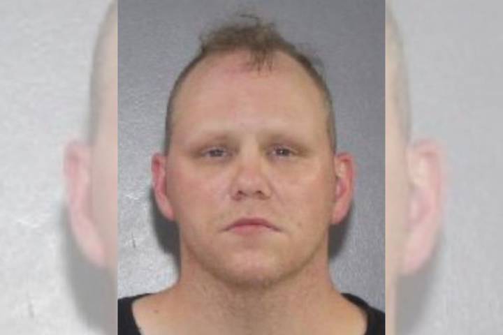 Surrey Police seek public help to locate wanted man