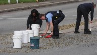 Police sweep up thousands of empty bullet casings at intersection of Guildford Road and First Avenue, Maylands