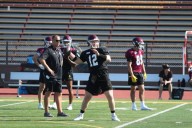 UMD football team taking a play