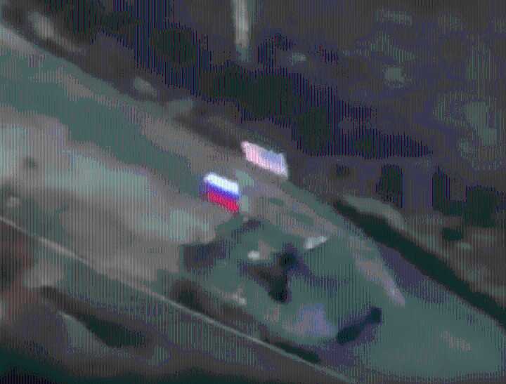 Moment warped Russian soldiers taunt Ukraine by flying an AMERICAN flag into battle ahead of crunch Zelensky