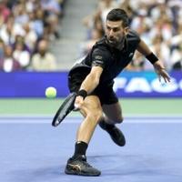 Djokovic shrugs off blisters to advance at US Open