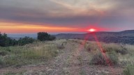 Why do wildfires make sunsets more colorful?