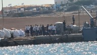 At least 26 dead and around a dozen missing after migrant boat capsizes off coast of Italian island
