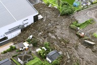 Heavy rain slams southern Japan, triggering floods and mudslides