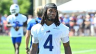James Cook warms up but opts not to play for Bills amid contract drama