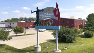 Years after abuse reports, ex-coach at renowned US gymnastics academy is arrested by FBI