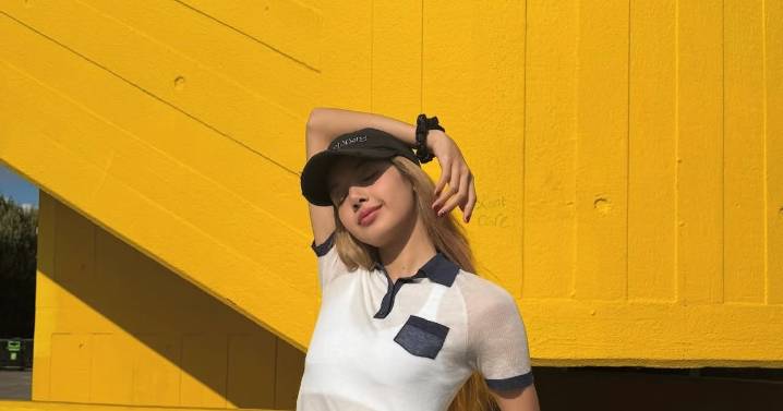Blackpink’s Lisa Puts Her Twist On the Polo in Sheer Shirt & Ballet Flats