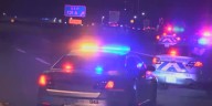 Woman in hospital after being found shot on side of I
