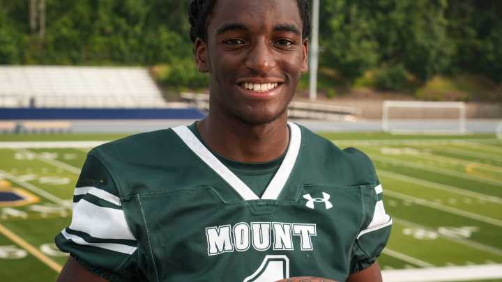 Delaware high school football players try to do an impression of their coach