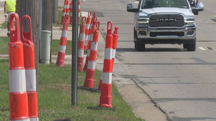 Cones come down on Plainfield Avenue for a short period before work resumes