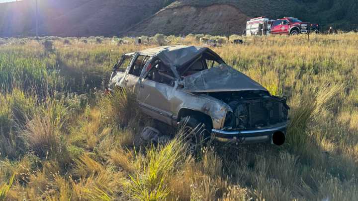 Person ejected from car, pinned under it after rollover crash on I