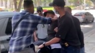 Man yells for help as apparent ICE agents carry him from LA courthouse into unmarked car, video shows