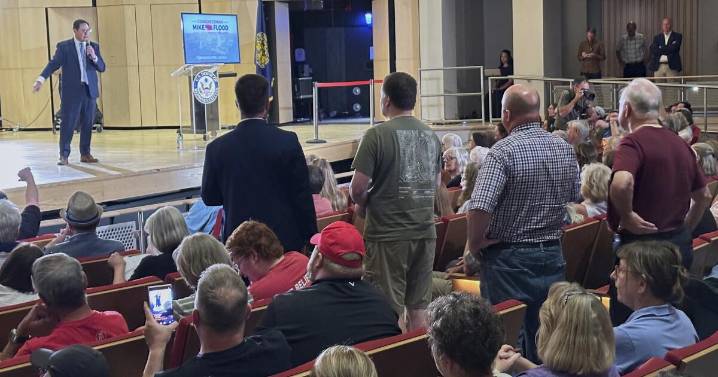 Nebraska Republican is shouted down by hostile crowd at a town hall on Trump's tax cuts