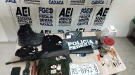 Catean casa de seguridad ligada al crimen organizado en Huatulco; aseguran arsenal, droga y vehículos