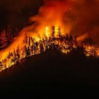 Threat from massive western Canada wildfire eases
