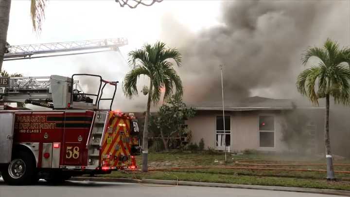 4 escape flames that erupted in back room of Margate home; fire extinguished