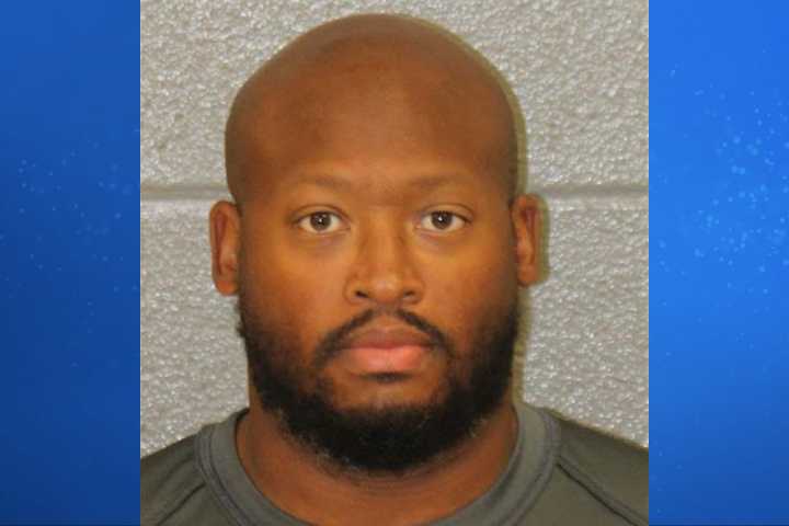 CMS administrator arrested after two guns found in fanny pack at Butler High School