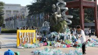 Artist drowns sculpture in plastic waste in front of the UN during plastic pollution treaty talks