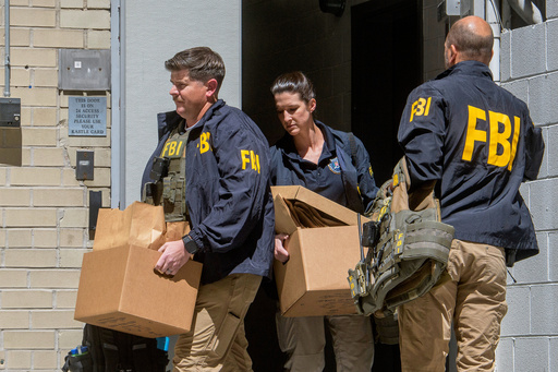Photos of FBI searching the home and office of John Bolton, a former Trump ally turned critic