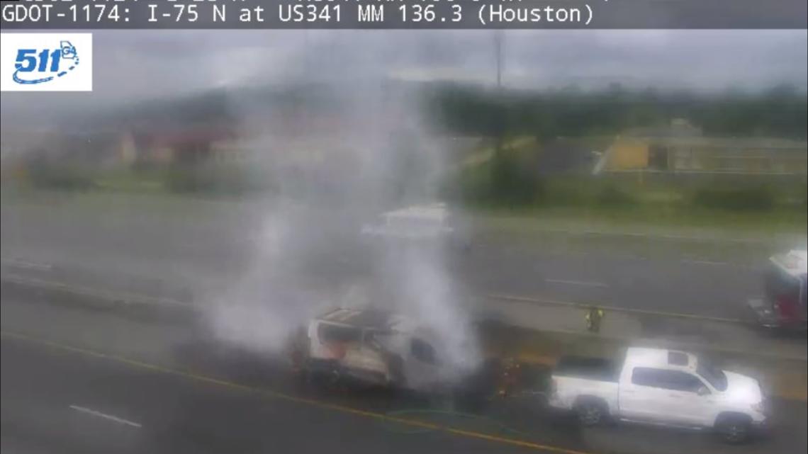 Van being pulled by tow truck catches on fire on I-75 in Perry, fire department says