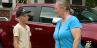 Iowa boy takes on the heat, selling water bottles to support wrestling dreams