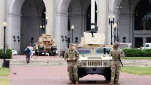 Some Guard units in Washington are now carrying firearms, Pentagon says. Trump targets more cities