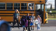 Is it legal for drivers to pass a school bus in Michigan?