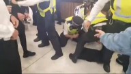 Police officer ‘punched in face’ during clashes with anti